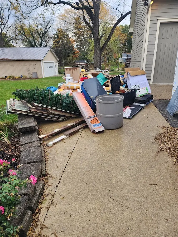 Dumpster being loaded with debris for 3 Yard Dumpster Rental in Clintonville